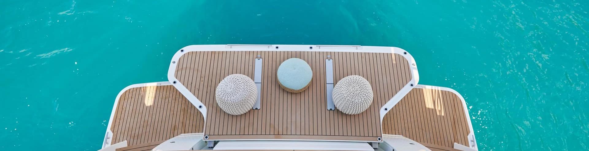 Yachts sailing on lake with emerald-like water